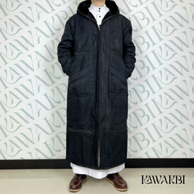 Person wearing a long black coat against a white background with 'KAWAKBI' branding.